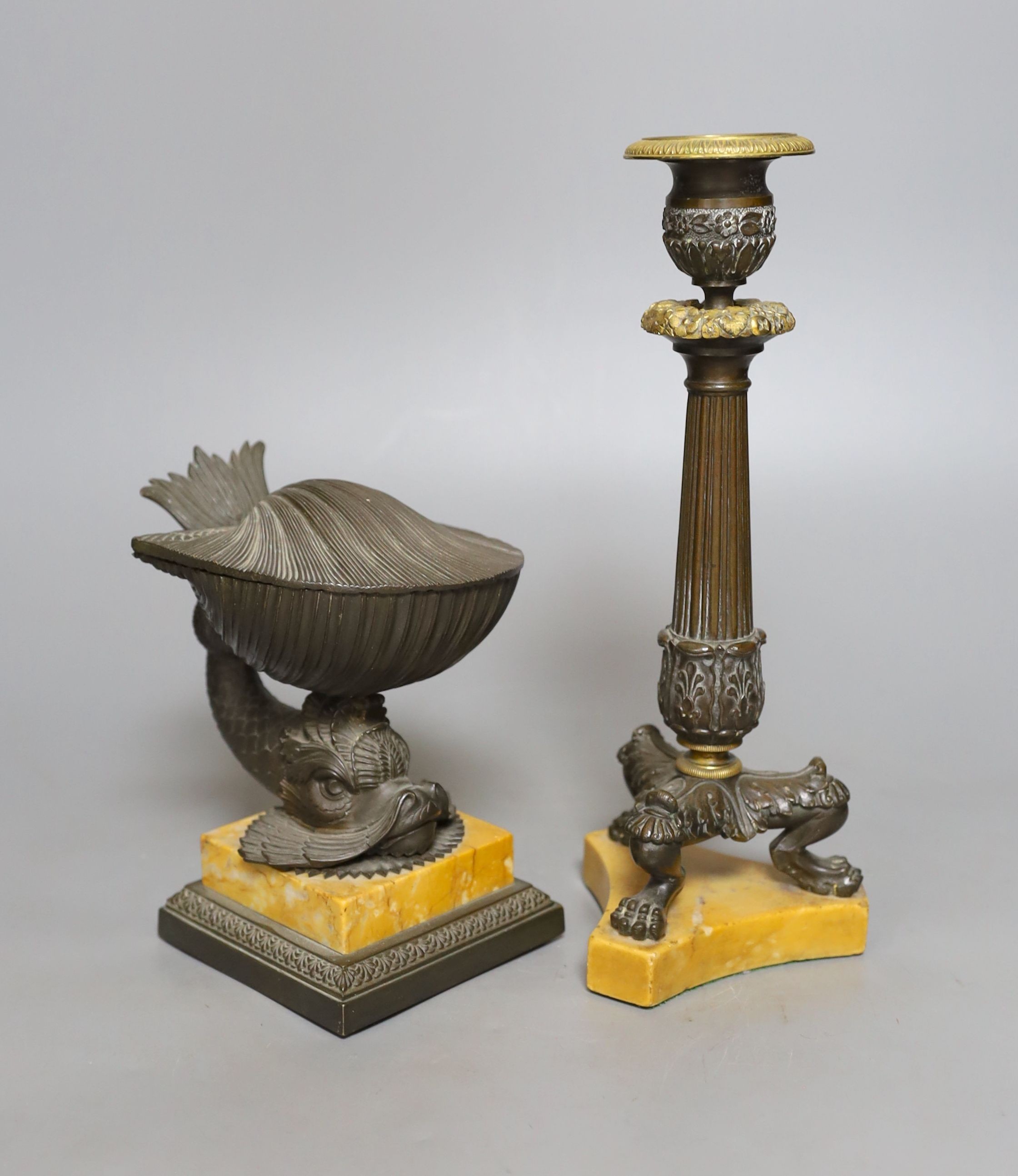 A 19th century bronze dolphin inkstand, 15cm. high, and a similar candlestick, on Sienna marble bases